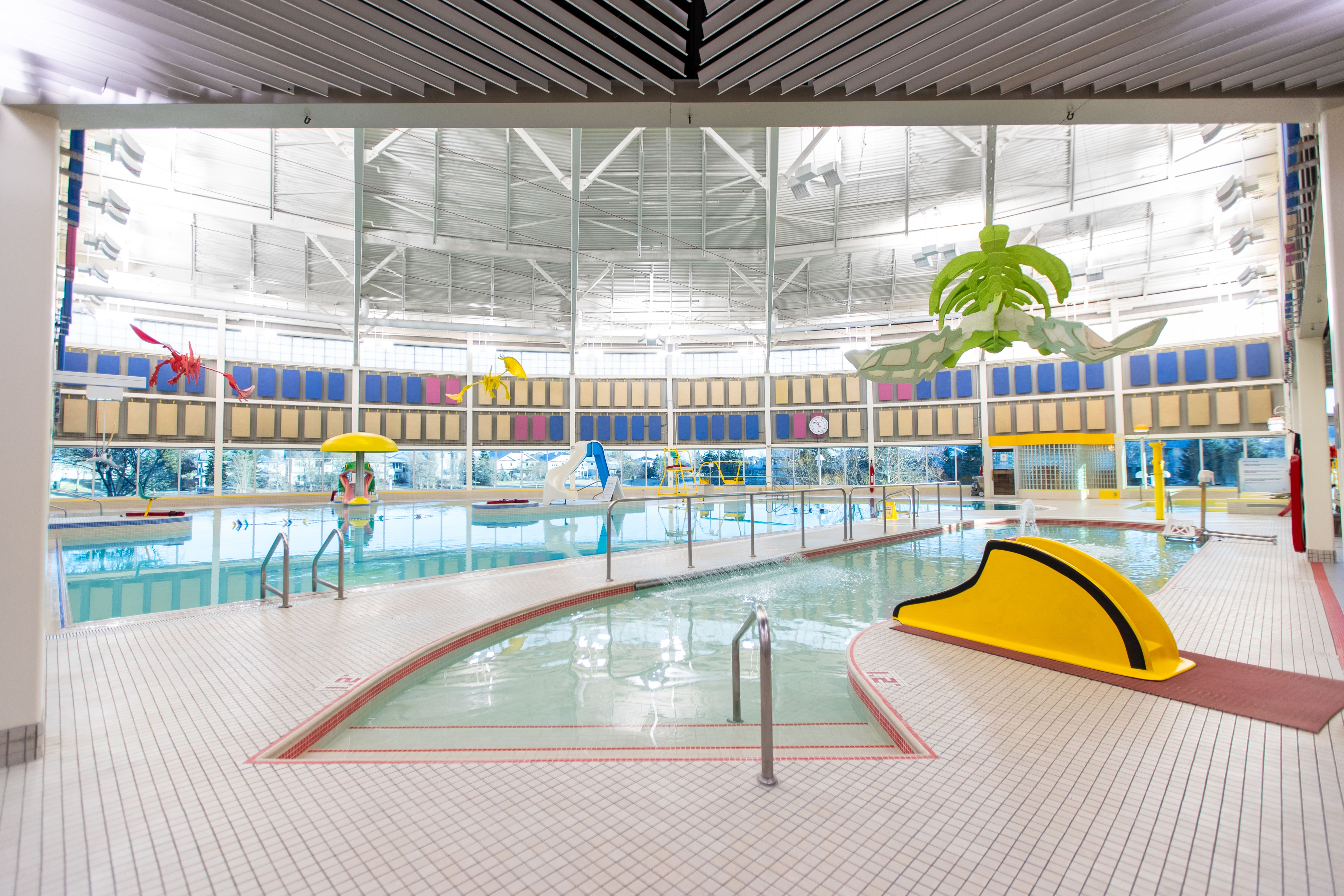 The tot pool at the SSLC showing steps into the pool and a small tot slide.